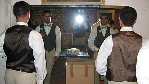 Groomsmen in front of a mirror